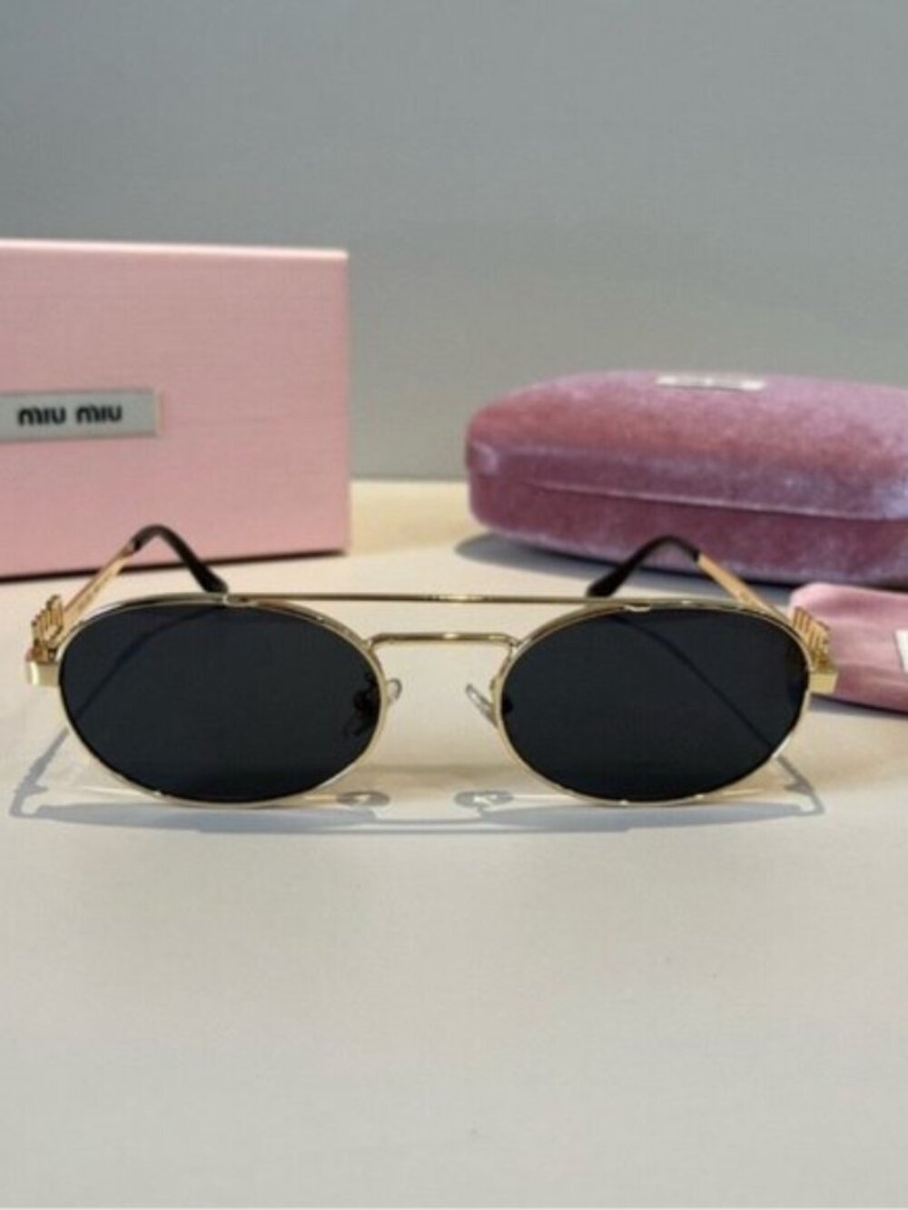 Miu Miu Gold and Black Sunglasses